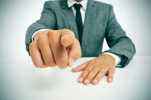 man in suit pointing the finger