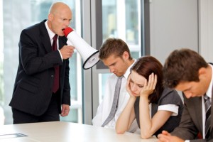 Young confident caucasian businessman screaming on his employee